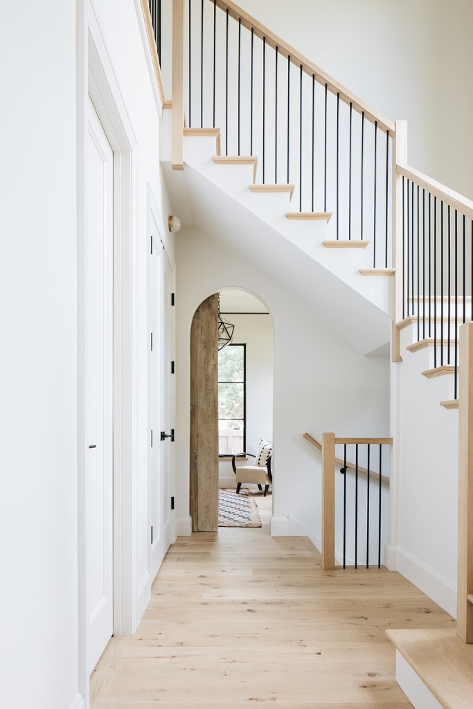 Modern english farmhouse archway and stairs
