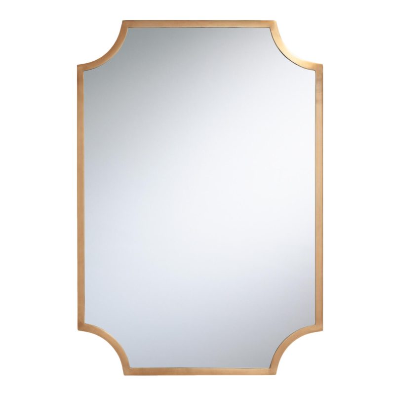 mirror lined with brass with curved notches in corners
