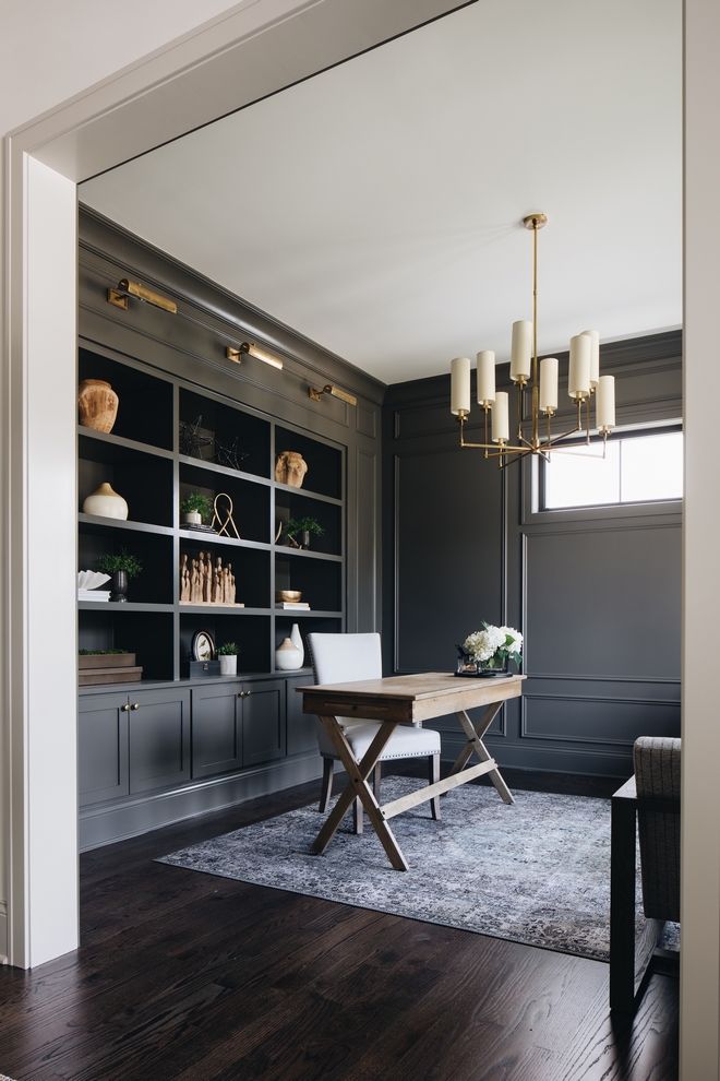 Modern Farmhouse office with desk and ceiling height shelves
