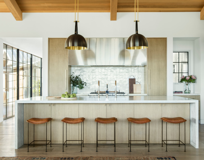 California Farmhouse style kitchen with pendant lights and a long island.