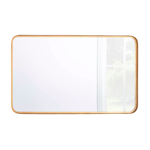 rectangular mirror with rounded corners framed by brass colored metal