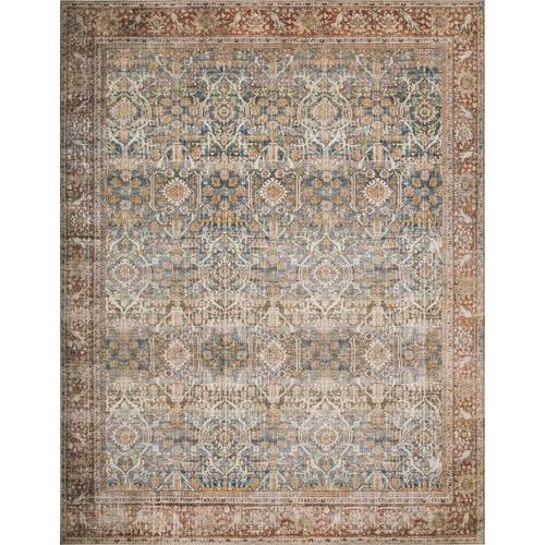 large area rug with faded blue and red oriental style patterns