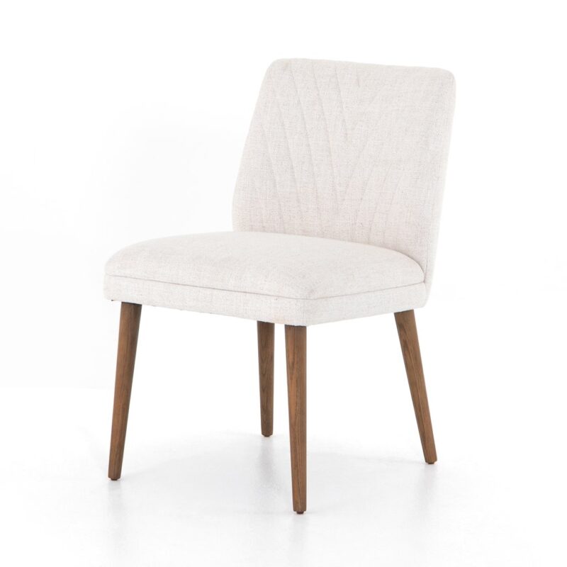 Cream upholstered armless dining chair with wood legs