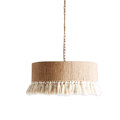 round pendant light with tan shade and beige tassels hanging from the edge