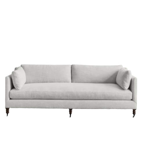 Sand colored sofa with arms and side pillows
