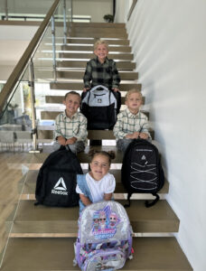 Back to school kids on entryway stairs