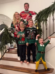 family wearing ugly family sweaters