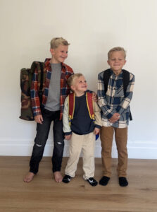 3 boys wearing back to school items